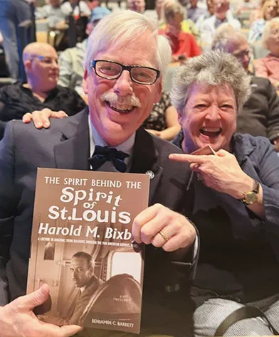 Ben Barrett, grandson of Harold Bixby with wife Cheryl, and the book he published about his grandfather's role in Charles Lindbergh's historic flight